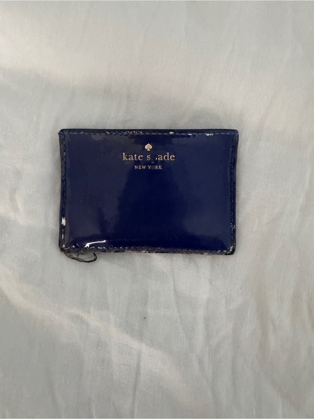 kate spade navy patent card case with gold logo